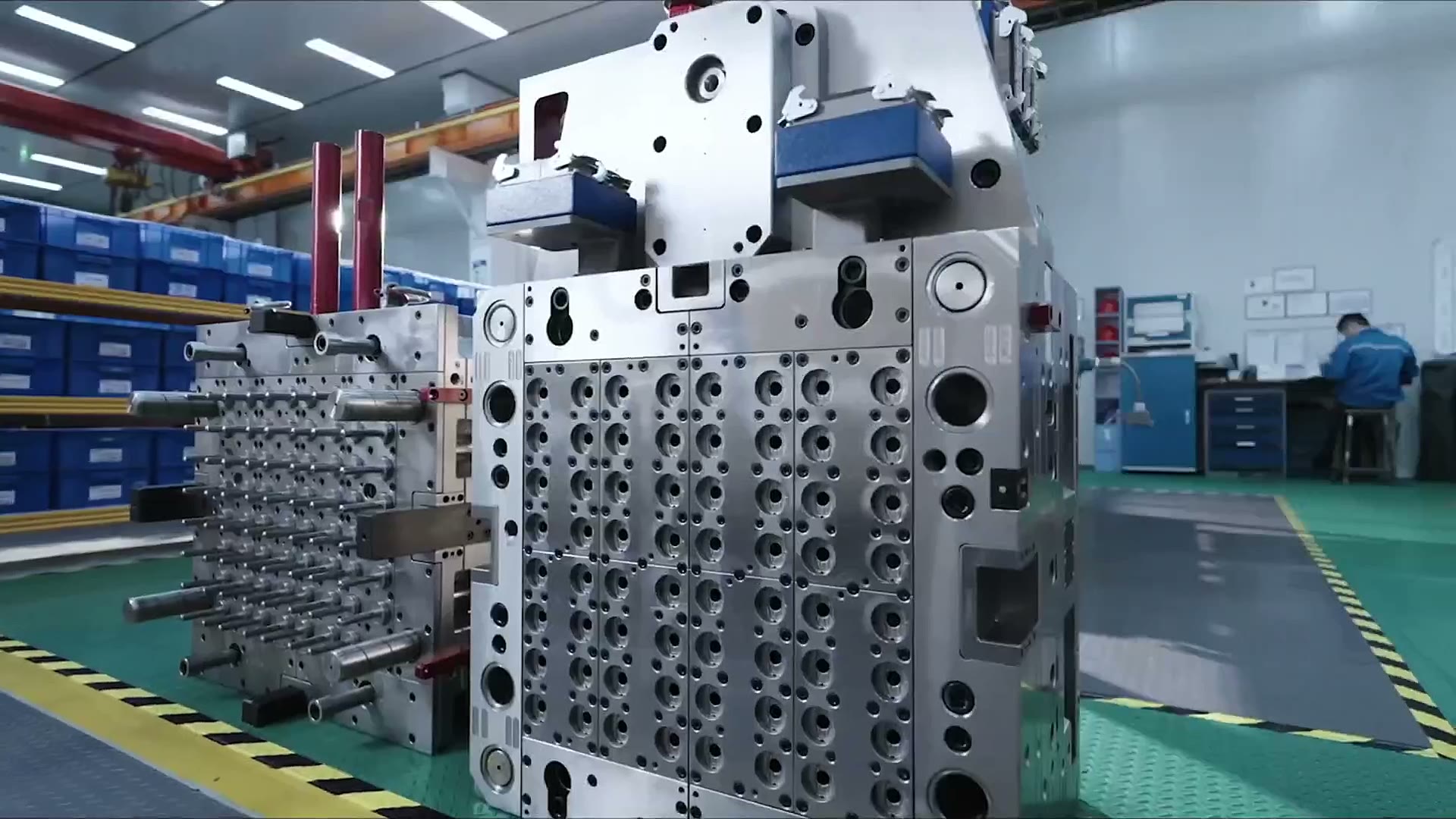 TK Group injection molding machine running a mold